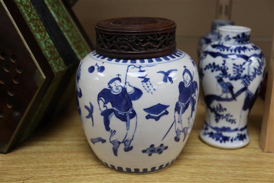 A 19th century Chinese blue and white ovoid jar, wood cover and two similar smaller vases tallest 15cm